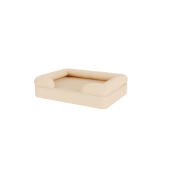 Een beige hondenbed.