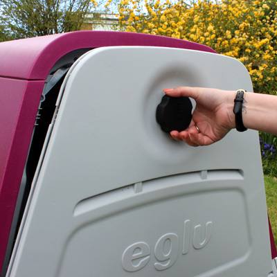 Opening the back door of an Eglu Go Hutch.